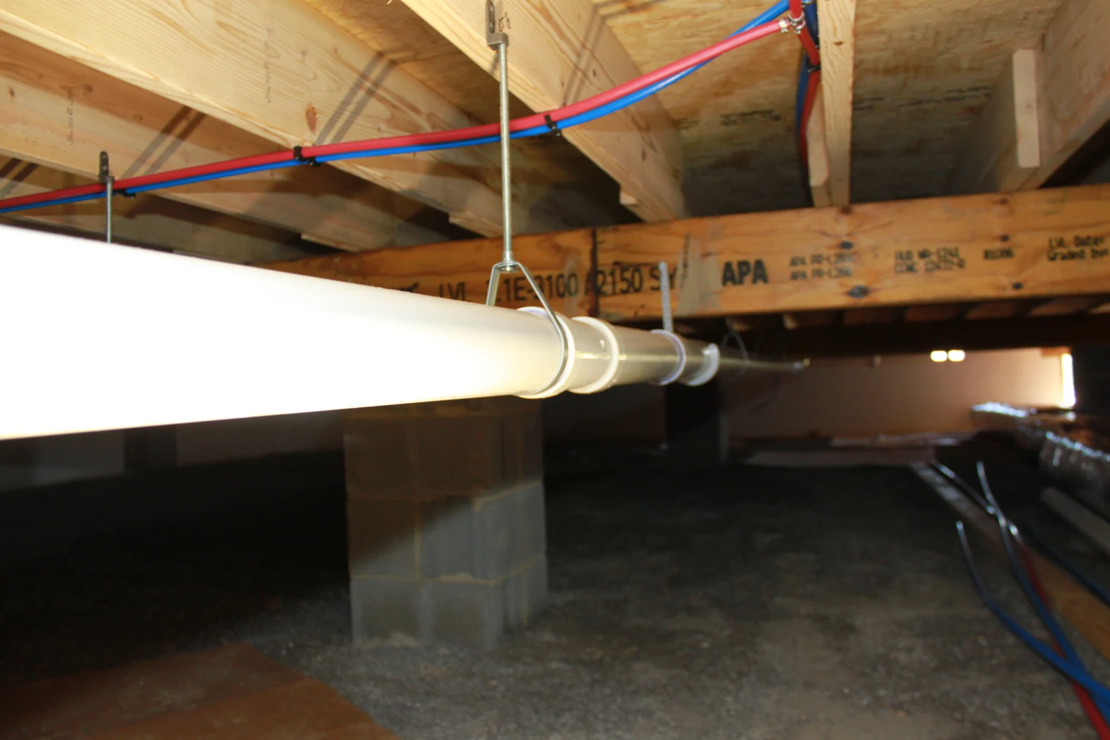 Under-floor drain routing and water-supply lines