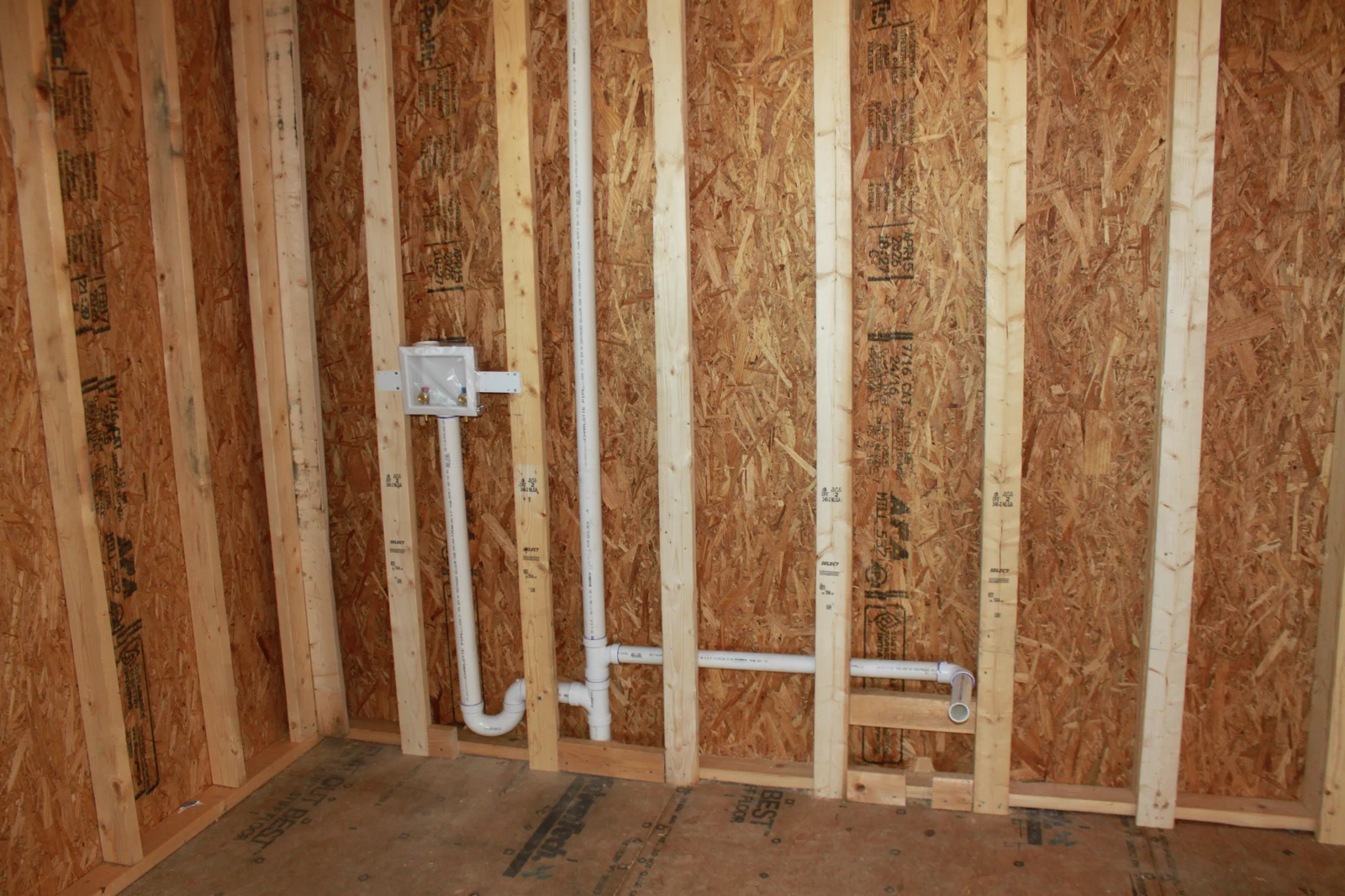 Laundry drain and vent piping before walls are closed