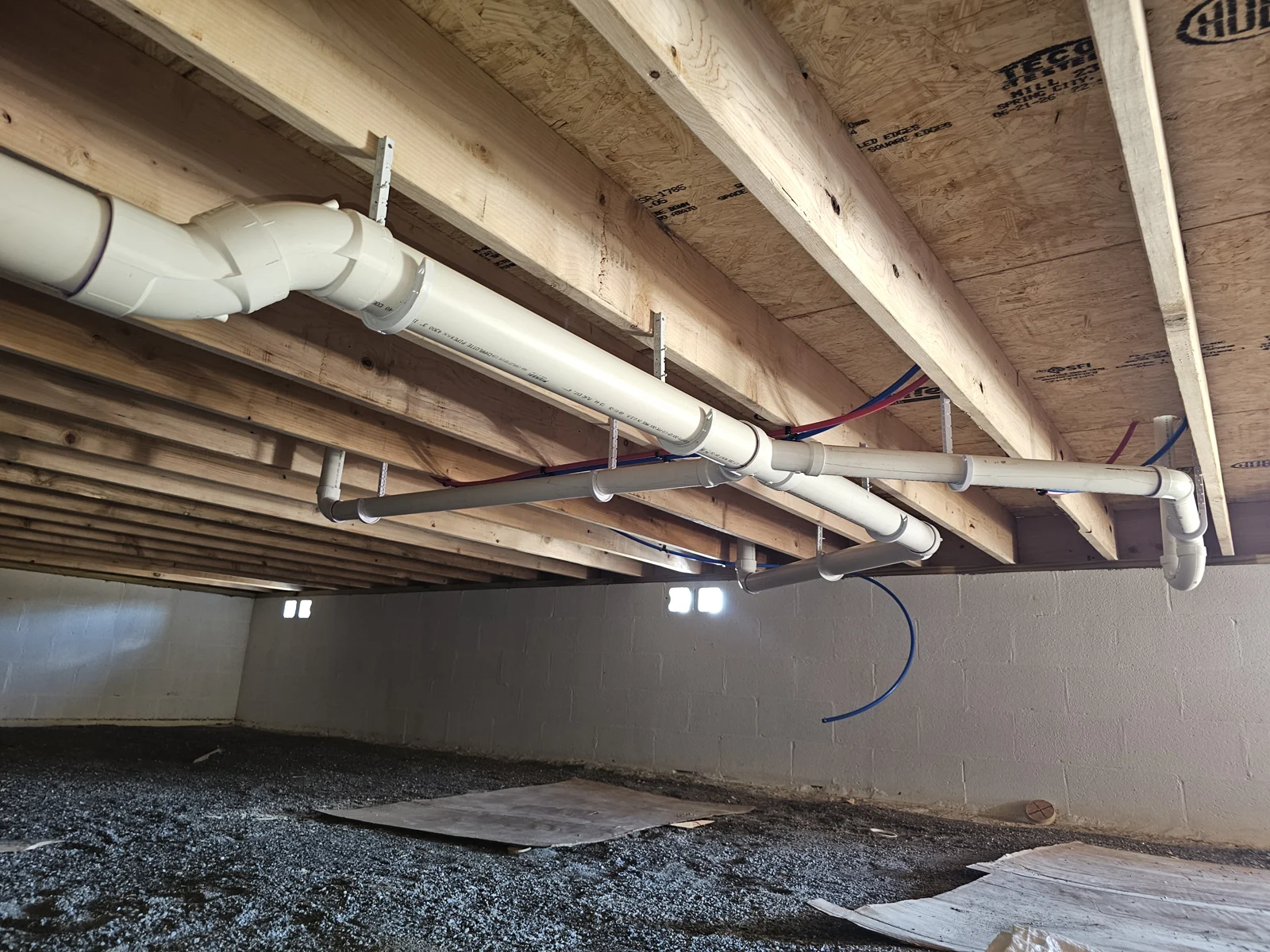 Residential drain piping beneath a home
