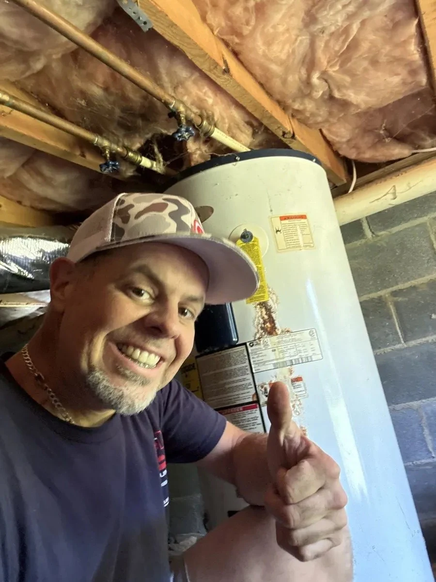 Mike beside a residential water heater