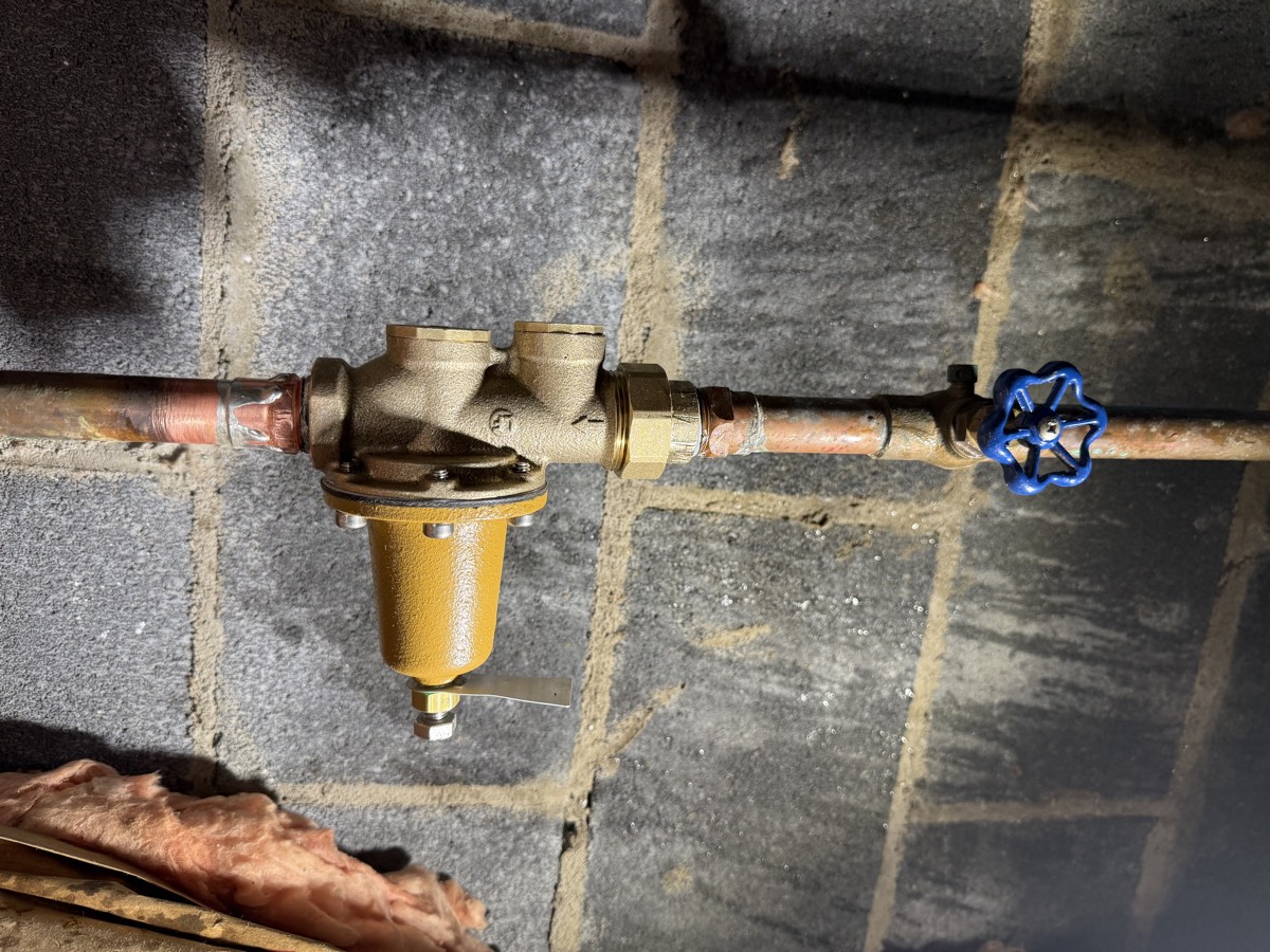 Brass pressure-reducing valve and shutoff installed on a home water line